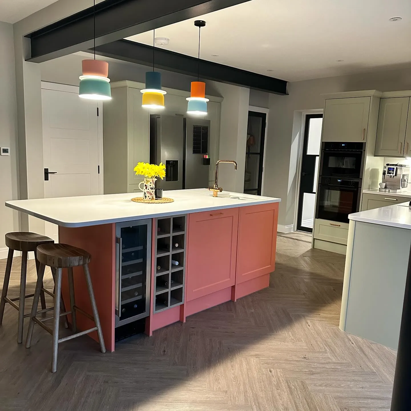 A kitchen with a center island and a wine rack.