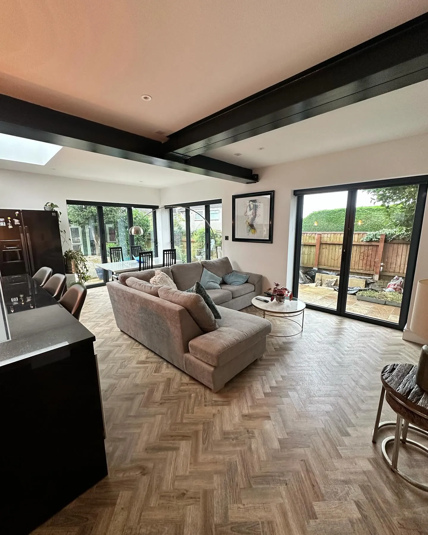 A living room filled with furniture and lots of windows.