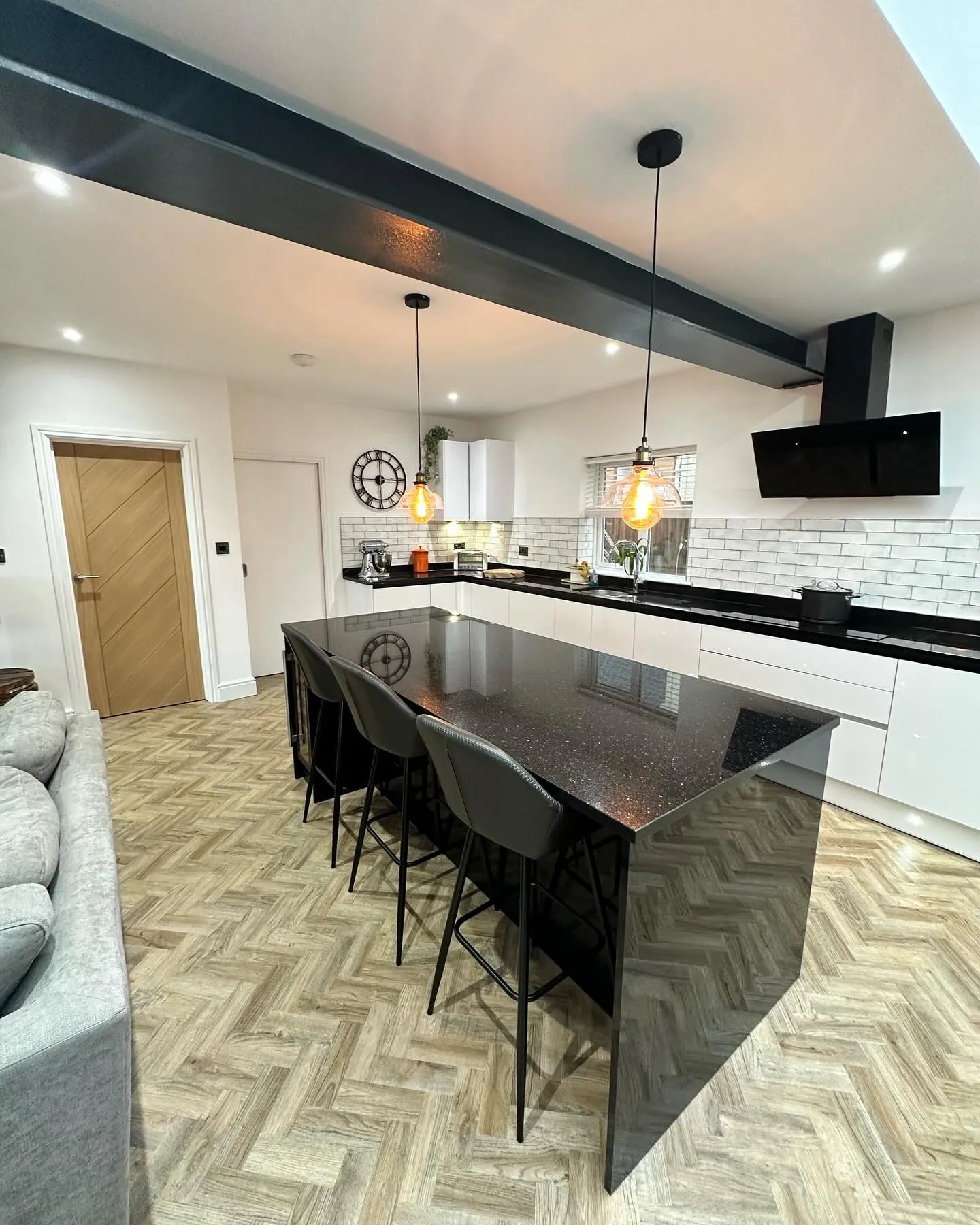 A large kitchen with a center island in the middle of the room.