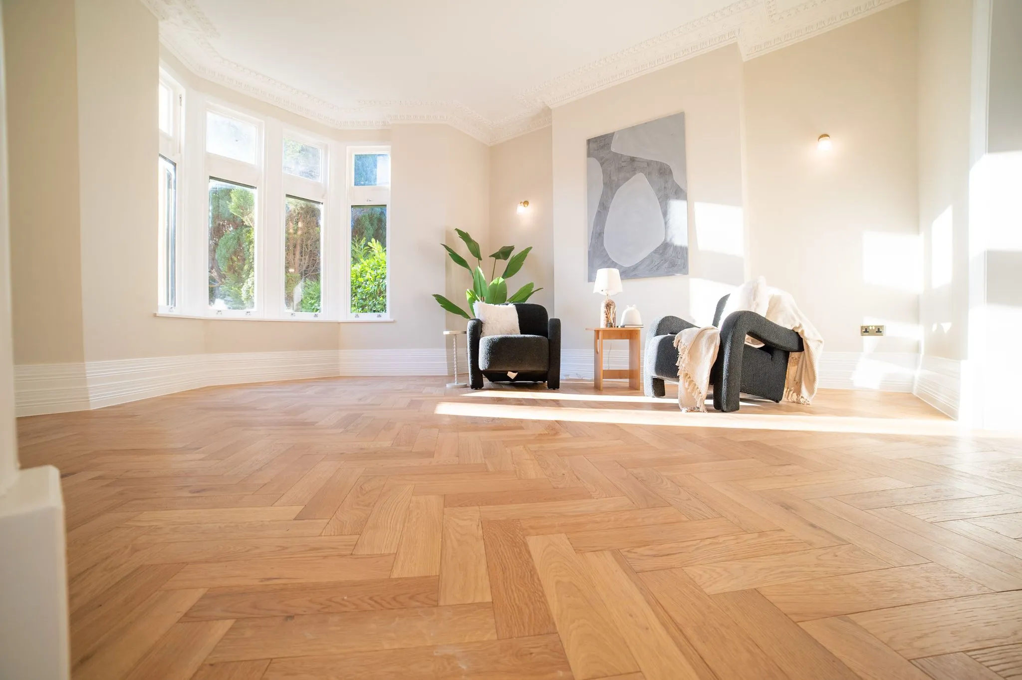 large wooden flooring with large wall picture