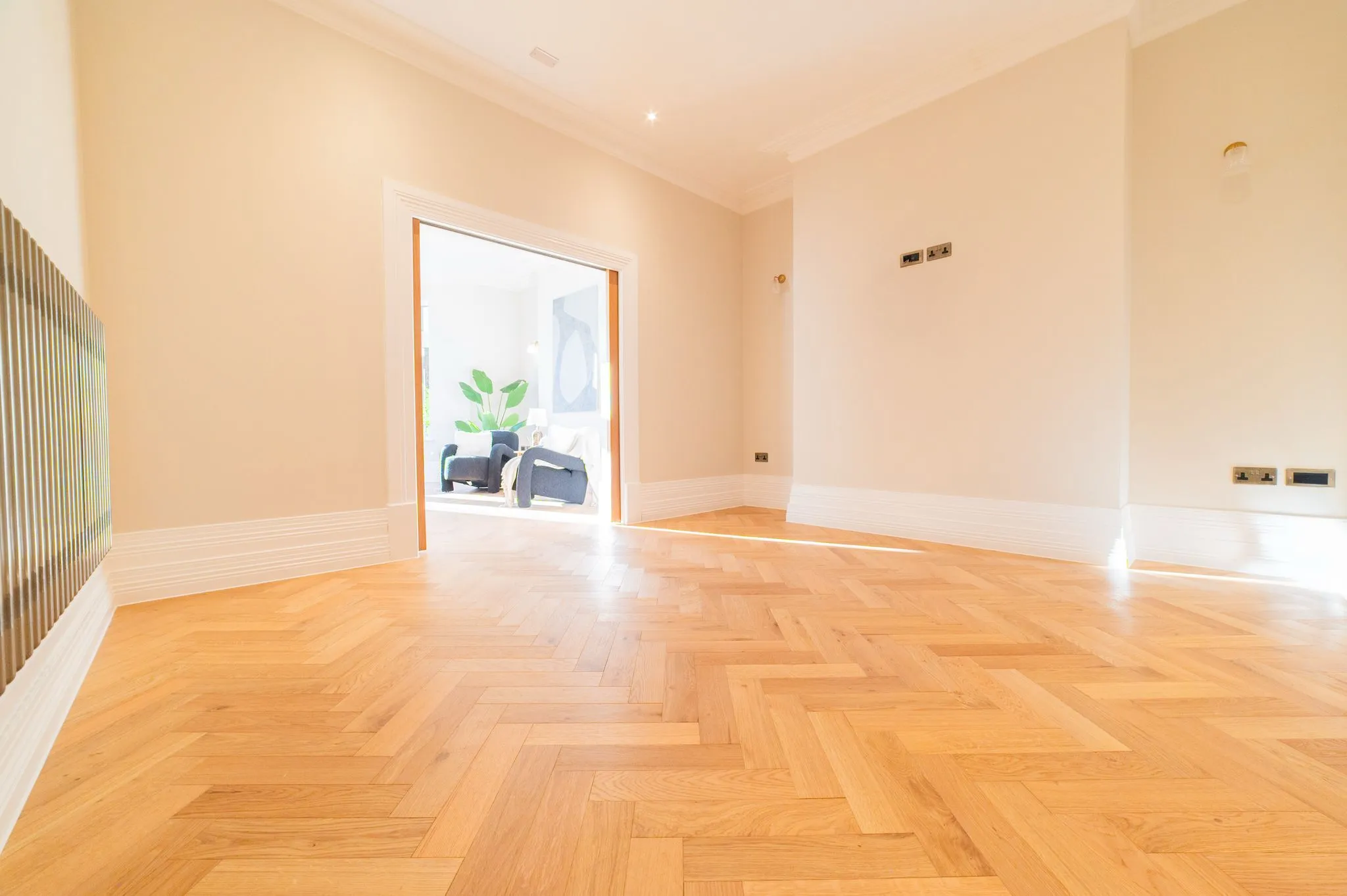 light wooden flooring with sun shinning through 